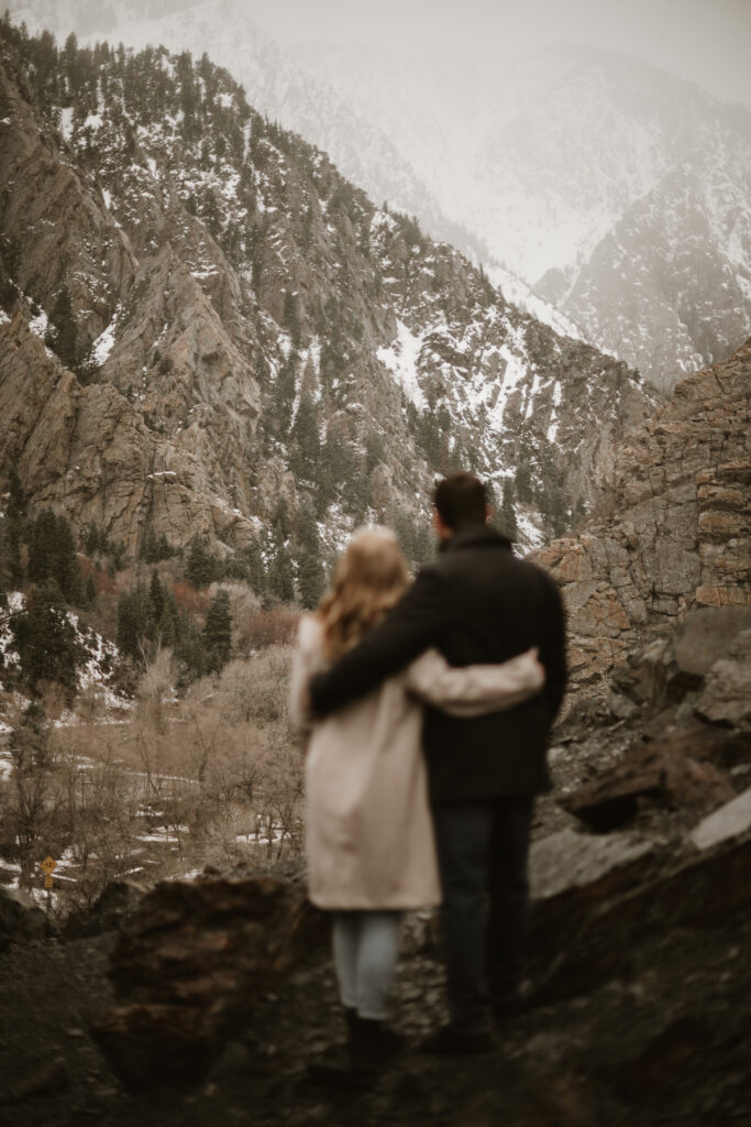 Couple walking around the mountains enjoying the view.