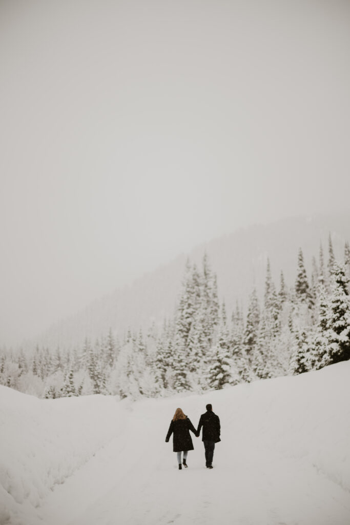 Couple walking around the mountains in the winter