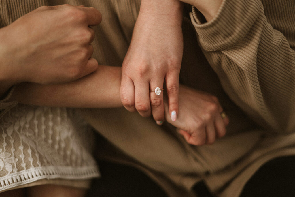 Oval engagement ring with solitary diamond.