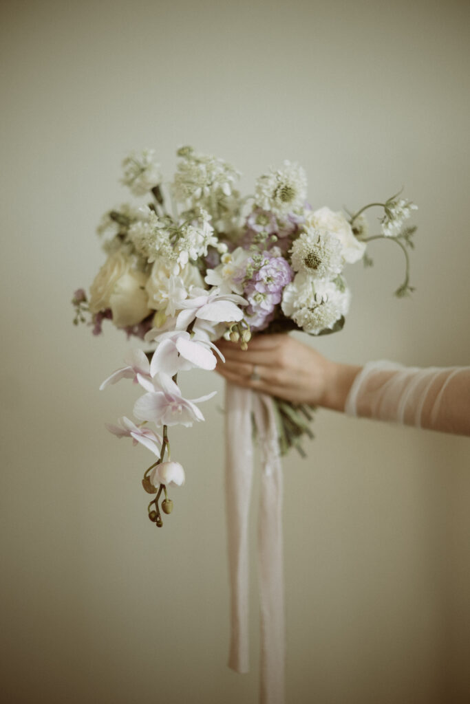 A purple and white wedding bouquet.