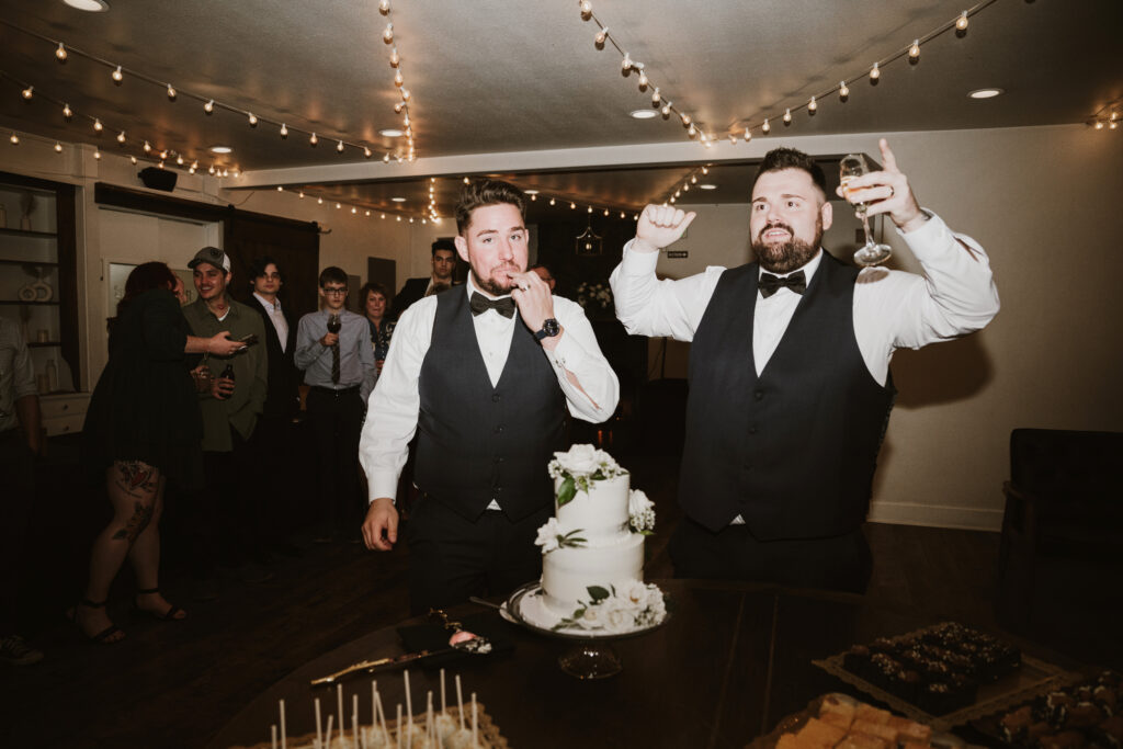 two grooms cake cutting