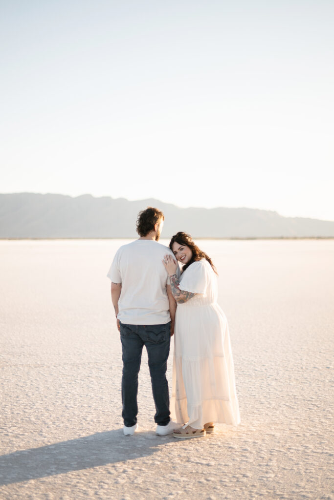 Couple taking engagement photos at the Salt flats