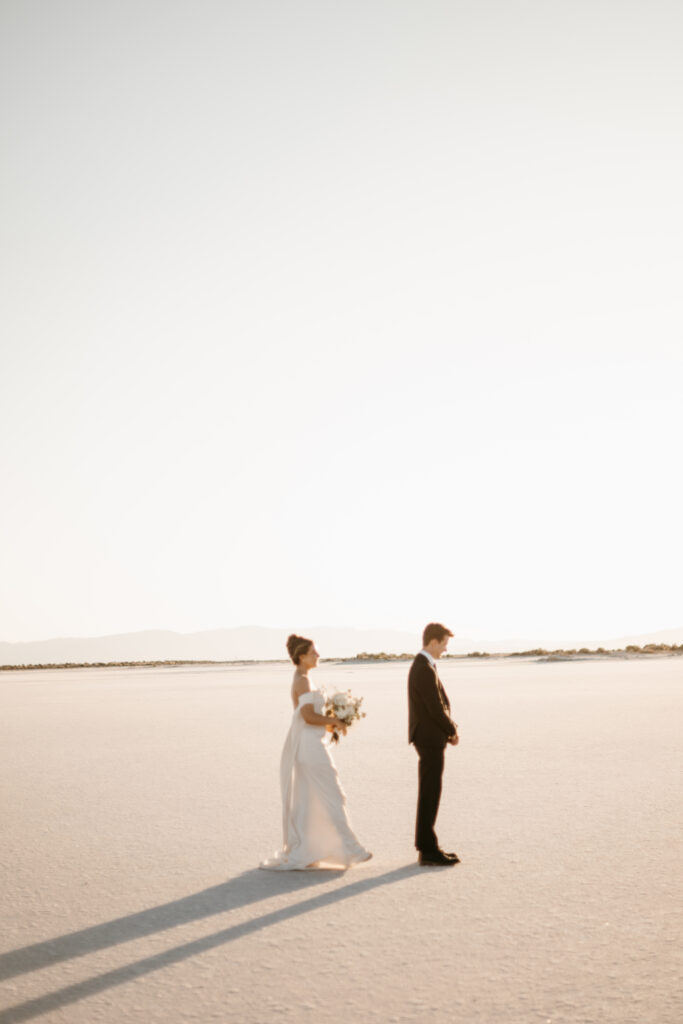 Bride and Groom's first look at the Bonneville Salt Flats in Utah before their wedding ceremony