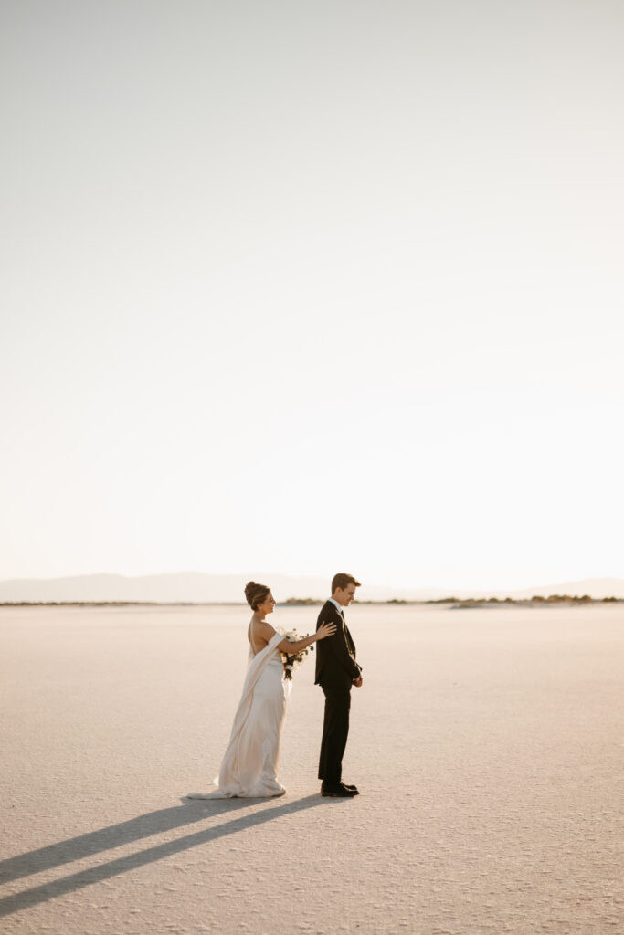 Bride and Groom's first look at the Bonneville Salt Flats in Utah before their wedding ceremony