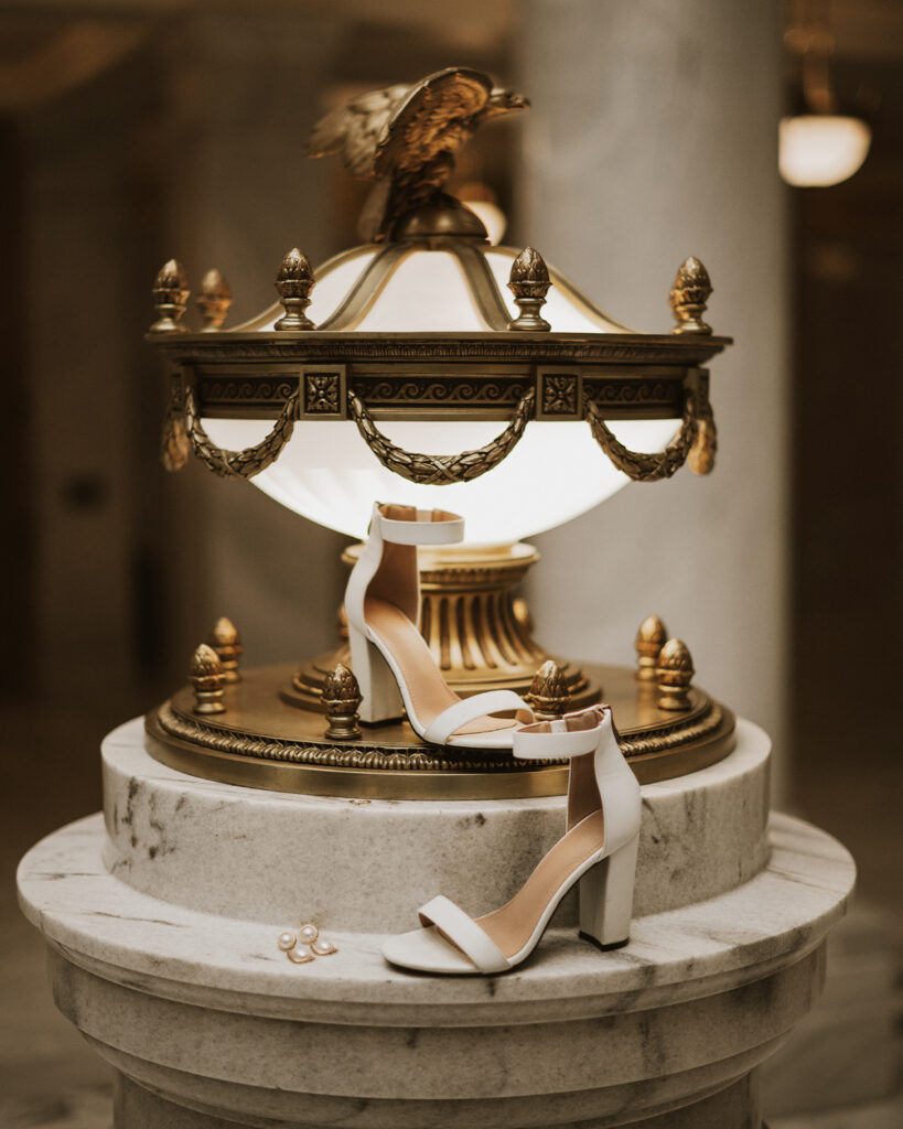Wedding shoes on a light fixture