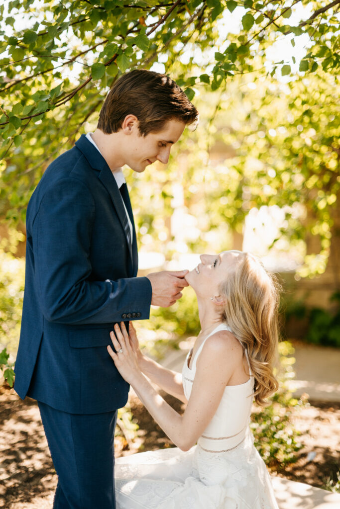 Couple getting engaged after a surprise proposal at Red Butte Garden