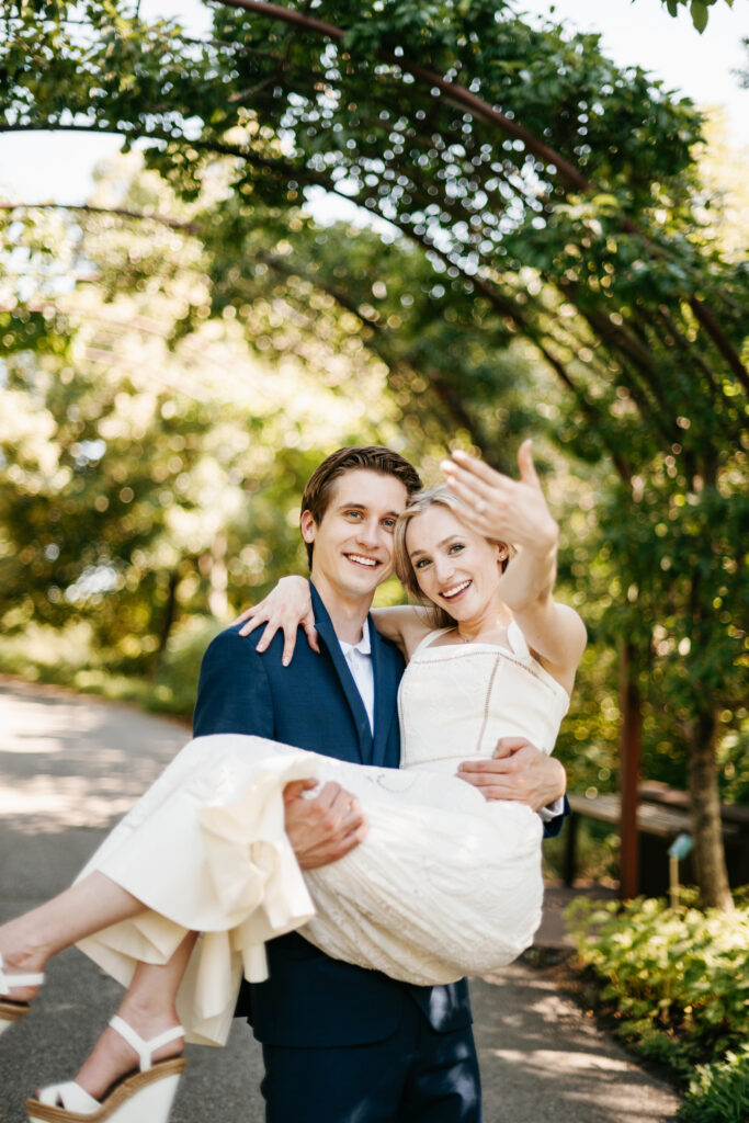 Couple getting engaged in a botanical garden in Utah.
