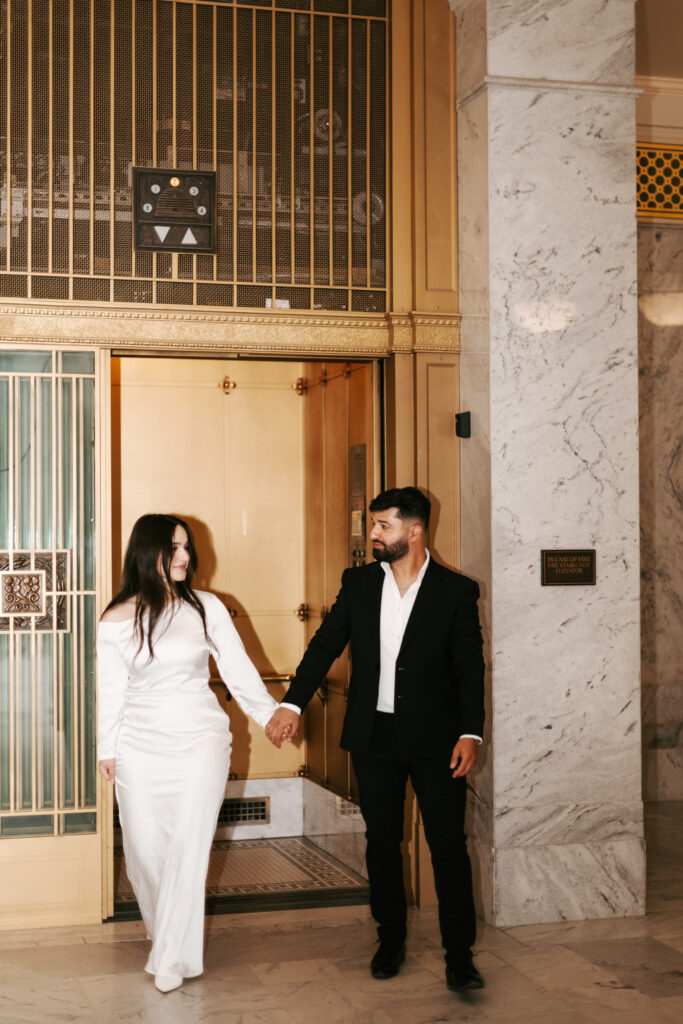 Engagement phots in a gold elevator