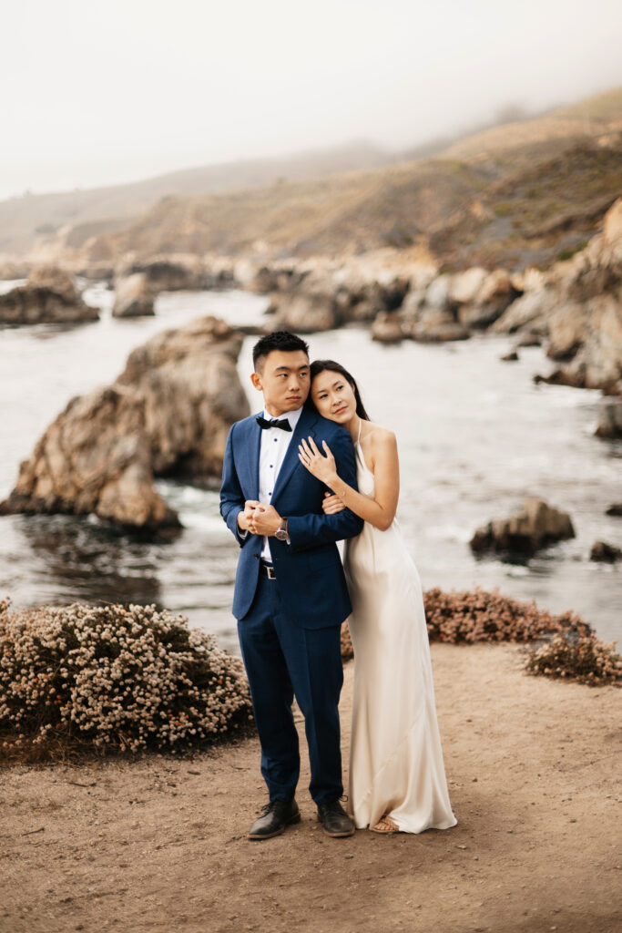 Bride and groom eloping on a cliff side in Big Sur California mid day