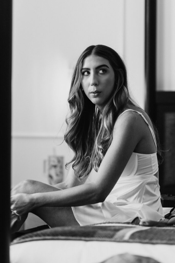 Bride getting ready for wedding in slip dress