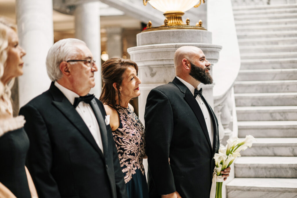 A Utah State Capitol building wedding day with guests