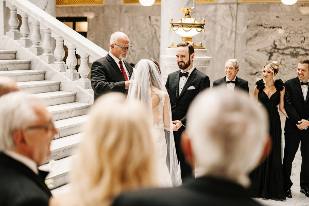 A Utah State Capitol building wedding day with guests