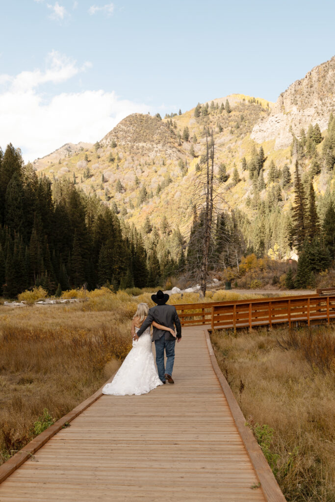 Bride and Groom walking on a boardwalk