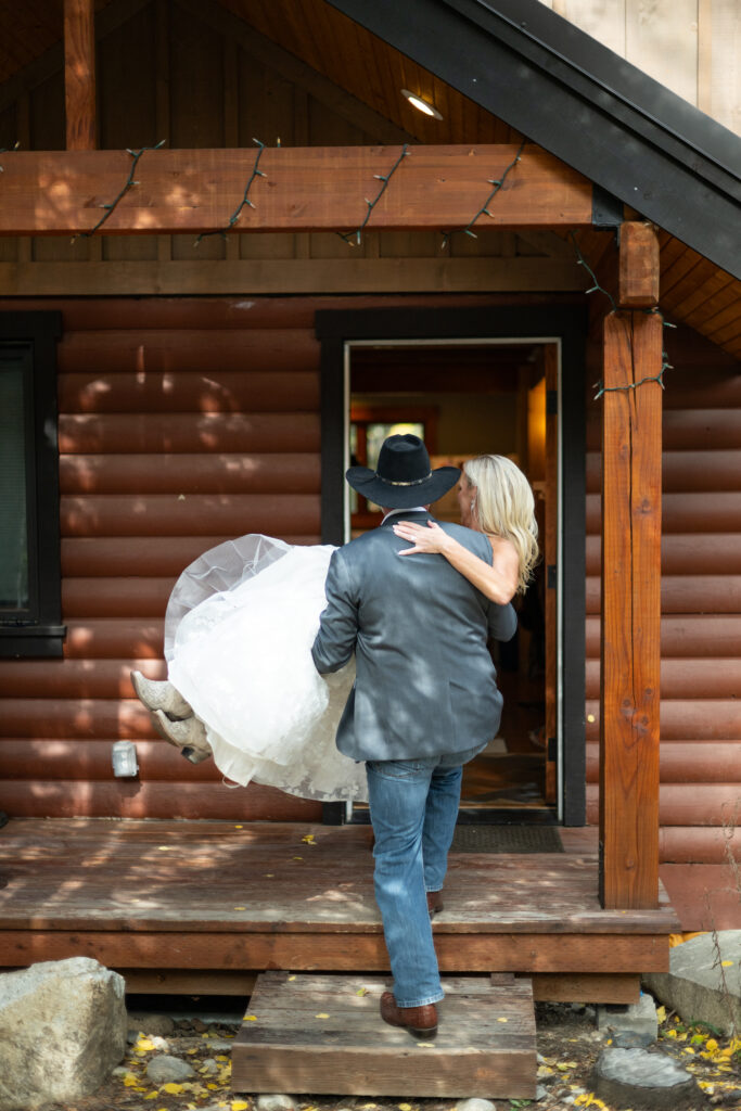 Bride and Groom in wedding attire in a cabin