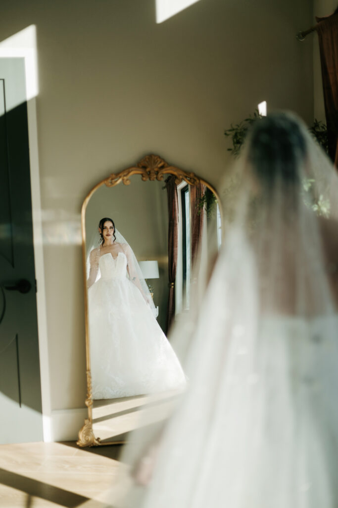 Bride getting ready in a beautiful getting ready space