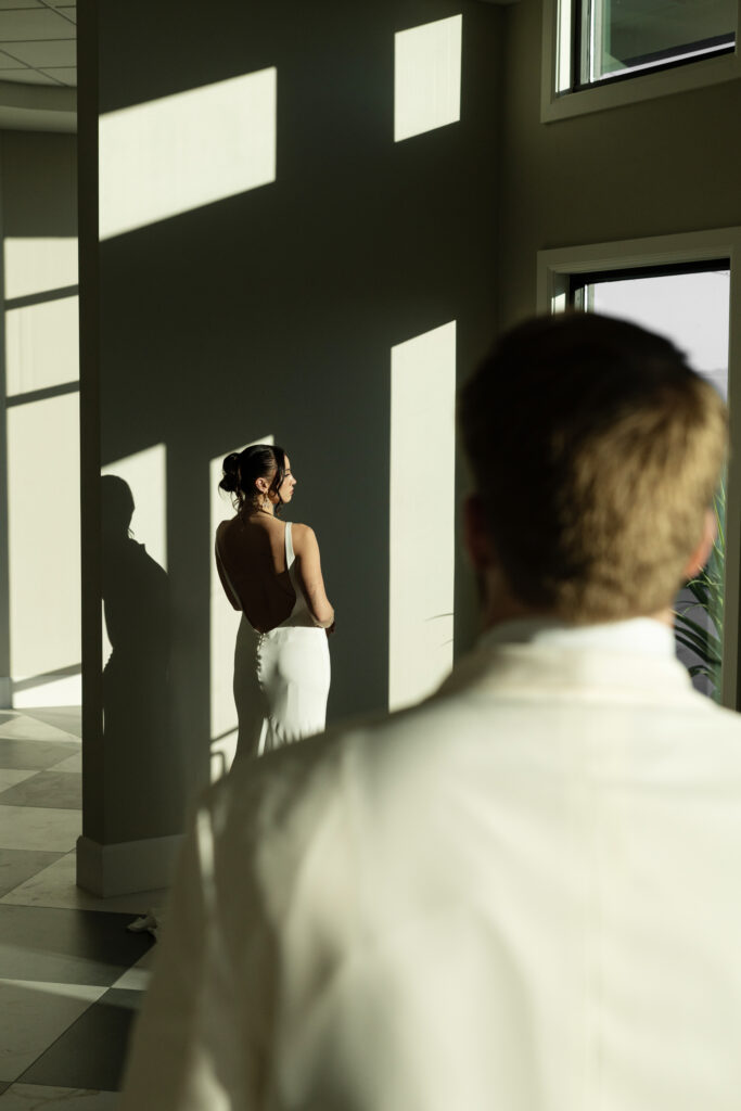 Bride and groom first look indoors
