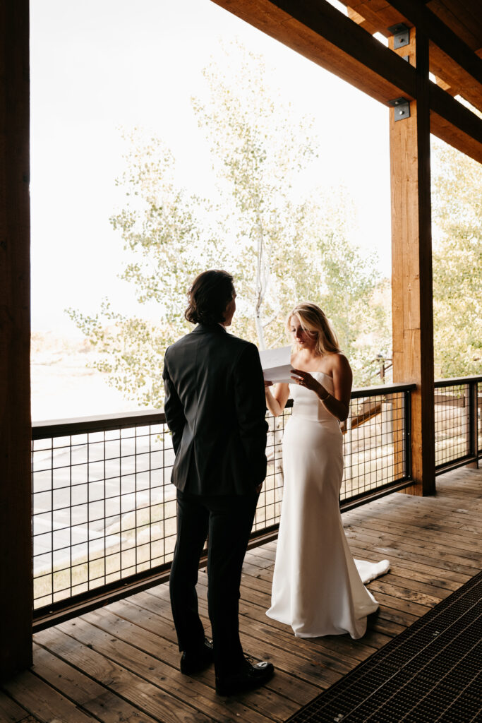 Bride and Groom reading private vows before the wedding ceremony