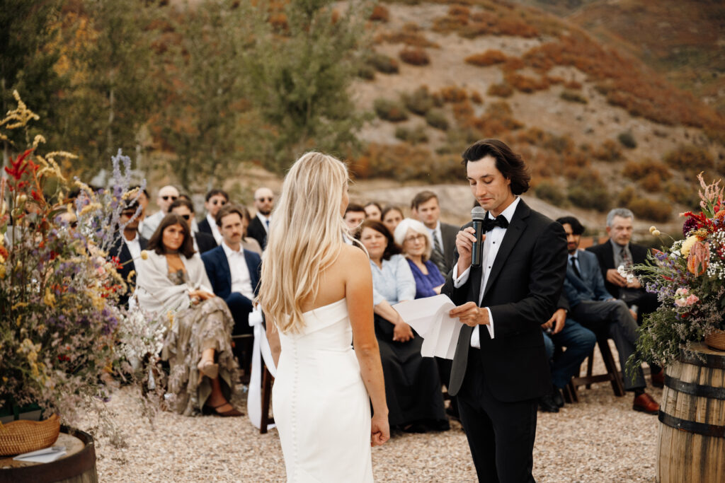 Bride and groom exchanging vows at high west in utah