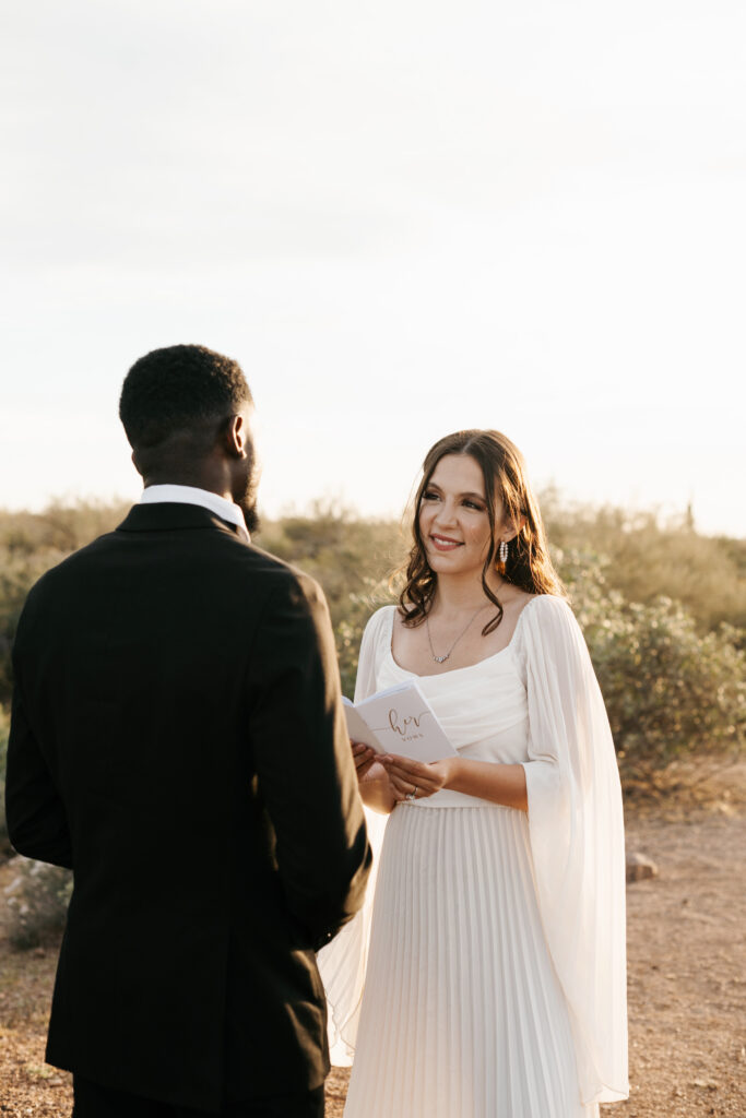 Best Places to Elope in Mesa Arizona with cactus and a view of the Superstition mountains.