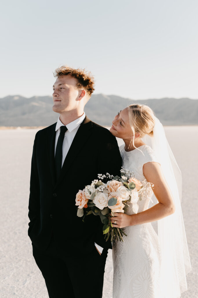 Sunset elopement portraits at Bonneville Salt Flats with soft pastel sky