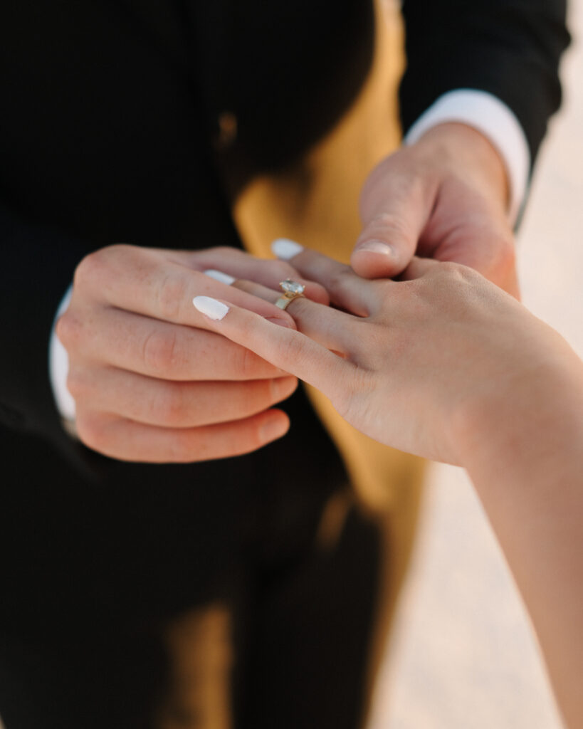 Intimate elopement ceremony at Bonneville Salt Flats in Utah with officiant and couple