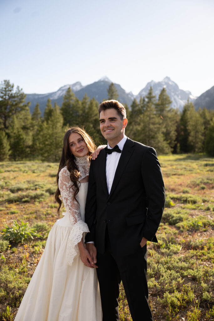 Bride and Groom eloping at Mormon row in Grant Teton National Park at sunset with a view of the mountains