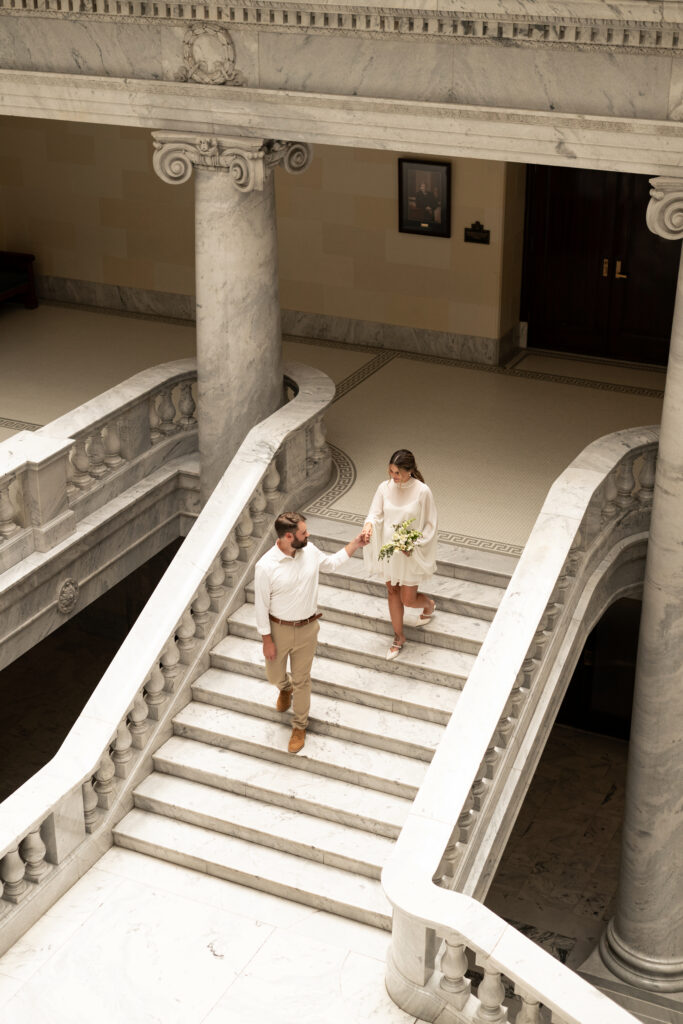 Bride and Groom eloping at the Utah State Capitol Building indoors during the morning
