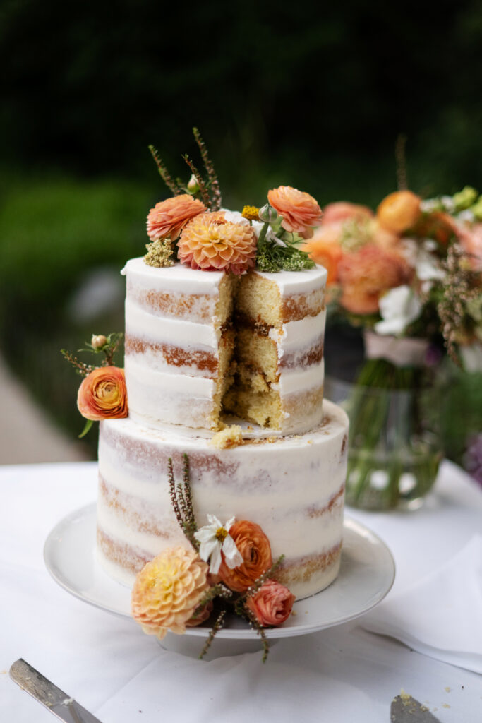 Micro wedding cake with orange flowers