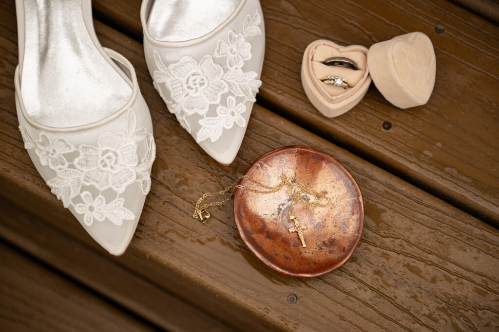Flat lay with wedding shoes and jewelry 