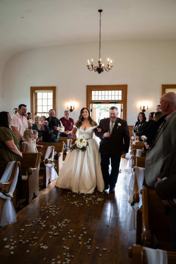 Bride and dad walking down the aisle 