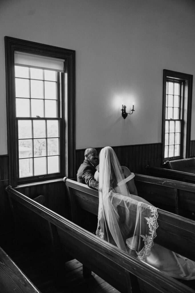 Bride and Groom sitting in church pew