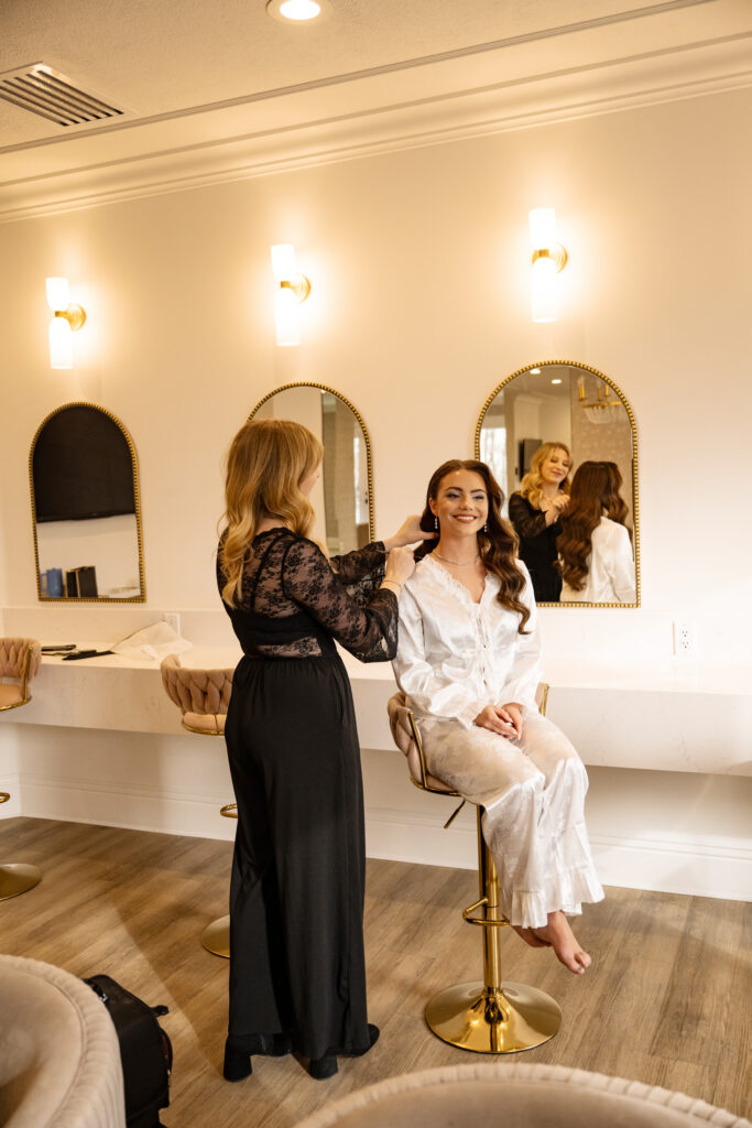 Bride getting ready with makeup artist